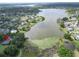 Breathtaking aerial view of a expansive lake with lush green landscapes showcasing waterfront properties and serene natural beauty at 1204 Joe Henry Wheeler Dr, Dover, FL 33527