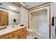 Cozy bathroom with a functional stand-up shower, vanity sink, and classic wall coverings at 1204 Joe Henry Wheeler Dr, Dover, FL 33527