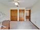 This spacious bedroom includes closet space, wood trim, and ample lighting at 1204 Joe Henry Wheeler Dr, Dover, FL 33527