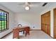 This bedroom has a large window, classic ceiling fan, and ample closet space at 1204 Joe Henry Wheeler Dr, Dover, FL 33527