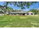 Charming single-story home with stone accents, black shutters, and a spacious front yard at 1204 Joe Henry Wheeler Dr, Dover, FL 33527