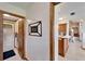 Welcoming hallway leads to a bathroom and kitchen, enhanced by a decorative 'Welcome Home' sign at 1204 Joe Henry Wheeler Dr, Dover, FL 33527