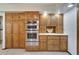 Kitchen featuring stainless steel oven appliances and wooden cabinets at 1204 Joe Henry Wheeler Dr, Dover, FL 33527