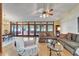 Open living area with hardwood flooring, comfortable seating, and large glass doors leading to the outdoor space at 1204 Joe Henry Wheeler Dr, Dover, FL 33527