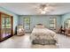 Bright main bedroom features tile floors and plenty of natural light from two windows at 1204 Joe Henry Wheeler Dr, Dover, FL 33527