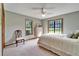 Comfortable primary bedroom features a bright room, two windows, and neutral decor at 1204 Joe Henry Wheeler Dr, Dover, FL 33527