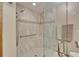 Tiled shower enclosure with glass door and shower head in a naturally-lit modern bathroom at 1204 Joe Henry Wheeler Dr, Dover, FL 33527
