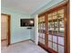 Bright sitting area featuring French doors leading to the outdoor deck at 1204 Joe Henry Wheeler Dr, Dover, FL 33527