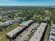 A stunning aerial view of the condo community and its pool surrounded by lush green landscape at 12300 Park Blvd # 202, Seminole, FL 33772