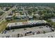 Aerial shot showing the community with a pool, parking area, and surrounding residential neighborhood at 12300 Park Blvd # 202, Seminole, FL 33772