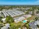 Wide aerial view of a condo community featuring manicured grounds and a tranquil residential setting at 12300 Park Blvd # 202, Seminole, FL 33772