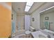 A classic bathroom with a shower/tub combo, tiled walls, and a vanity with a sink and mirror at 12300 Park Blvd # 202, Seminole, FL 33772
