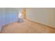 Bedroom featuring carpet flooring, a closet with white sliding doors, and a nightstand with a lamp at 12300 Park Blvd # 202, Seminole, FL 33772