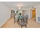 Charming dining area with seating for four, illuminated by a chandelier, and adjacent to the kitchen at 12300 Park Blvd # 202, Seminole, FL 33772