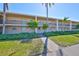 Low rise apartment building with green landscaping, walkways and multiple units at 12300 Park Blvd # 202, Seminole, FL 33772
