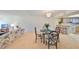 Combined living and dining area showcasing an open layout with bar seating and kitchen access at 12300 Park Blvd # 202, Seminole, FL 33772