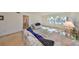 Well-lit living room with cozy seating, a large window, and neutral decor at 12300 Park Blvd # 202, Seminole, FL 33772