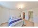 Bright bedroom with carpeting, direct access to closet space, and an en-suite bathroom at 12300 Park Blvd # 202, Seminole, FL 33772