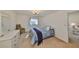 Comfortable bedroom with a dresser, chair, soft carpeting and natural light at 12300 Park Blvd # 202, Seminole, FL 33772