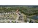 Aerial view of a neighborhood showcasing the home's proximity to green spaces and a pond at 12308 Chaya Ct, Spring Hill, FL 34610