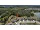 Aerial view of a neighborhood showcasing the home's proximity to green spaces and a pond at 12308 Chaya Ct, Spring Hill, FL 34610
