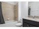 Bathroom featuring a shower over bath, dark wood vanity and granite countertops at 12308 Chaya Ct, Spring Hill, FL 34610