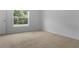 Bright bedroom with a window bringing in natural light at 12308 Chaya Ct, Spring Hill, FL 34610