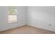 Bright bedroom with a window bringing in natural light at 12308 Chaya Ct, Spring Hill, FL 34610
