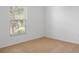 Bright bedroom with a window bringing in natural light at 12308 Chaya Ct, Spring Hill, FL 34610