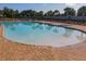 Large community pool featuring ample seating and a shallow area for Gathering fun and relaxation at 12308 Chaya Ct, Spring Hill, FL 34610