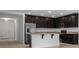 Open kitchen with granite countertops and stainless steel appliances at 12308 Chaya Ct, Spring Hill, FL 34610