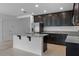 Open kitchen with granite countertops and stainless steel appliances at 12308 Chaya Ct, Spring Hill, FL 34610