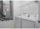 Functional laundry room equipped with modern washer and dryer units at 12308 Chaya Ct, Spring Hill, FL 34610