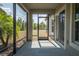 Screened in patio with a view of the backyard and sliding glass doors at 12308 Chaya Ct, Spring Hill, FL 34610