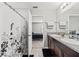 Bathroom features a double vanity and a shower-tub combo; bedroom visible through the open door at 12856 French Market Dr, Riverview, FL 33579
