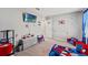 Spiderman themed bedroom is furnished with a bed, dresser, and small seating area, perfect for a imagination at 12856 French Market Dr, Riverview, FL 33579