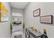 Hallway view showcasing decor and access to the living room, creating an inviting transition space at 12856 French Market Dr, Riverview, FL 33579