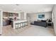 Open floor plan featuring a kitchen with a granite island and a cozy living area at 12856 French Market Dr, Riverview, FL 33579