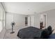 Spacious main bedroom featuring neutral walls and carpet flooring, complemented by an ensuite bathroom and walk in closet at 12856 French Market Dr, Riverview, FL 33579