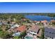 Aerial view showcases waterfront homes with docks on a scenic lake and views, reflecting a serene neighborhood ambiance at 1344 Monterey Ne Blvd, St Petersburg, FL 33704