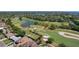 Stunning aerial view of the golf course and surrounding community, showcasing the lush greenery and scenic waterways at 1344 Monterey Ne Blvd, St Petersburg, FL 33704