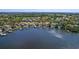 Breathtaking aerial view of waterfront homes with private docks and lush surroundings, showcasing coastal living at its finest at 1344 Monterey Ne Blvd, St Petersburg, FL 33704