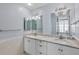 Bathroom featuring double sinks, granite countertops and natural light at 1344 Monterey Ne Blvd, St Petersburg, FL 33704