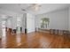 Bedroom featuring hardwood floors with closet space and an attached bathroom awaiting renovations at 1344 Monterey Ne Blvd, St Petersburg, FL 33704