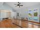 Renovation-ready bedroom with hardwood floors, ceiling fan, and direct access to the pool area at 1344 Monterey Ne Blvd, St Petersburg, FL 33704