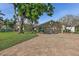 Beautiful home featuring a paver driveway, and lush landscaping at 1344 Monterey Ne Blvd, St Petersburg, FL 33704
