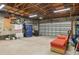 Spacious garage interior with ample storage space, overhead lighting, and concrete flooring for functionality and convenience at 1344 Monterey Ne Blvd, St Petersburg, FL 33704