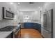 Modern kitchen with stainless steel appliances, custom cabinets and hardwood floors at 1344 Monterey Ne Blvd, St Petersburg, FL 33704