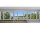 Bright room with large windows framing a picturesque waterfront view, enhancing natural light at 1344 Monterey Ne Blvd, St Petersburg, FL 33704