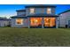 Spacious backyard featuring a covered patio and lush green lawn, perfect for outdoor activities at 18185 Cortes Creek Blvd, Spring Hill, FL 34610